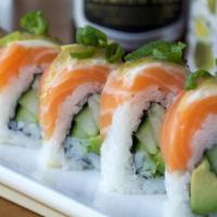 Yuzu Lemon Salmon Roll · Cucumber avocado roll with salmon sashimi, green onion, yuzu pepper and lemon on top. All ro...