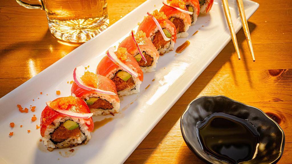 Cherry Blossom Roll · Spicy tuna roll with tuna sashimi, masago and red onion on top drizzled with spicy ponzu sauce. All rolls come with avocado, sushi rice and seaweed paper