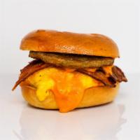 Bagel, Bacon, Sausage, Egg & Cheddar Sandwich · 2 scrambled eggs, melted Cheddar cheese, smoked bacon, breakfast sausage, and Sriracha aioli...