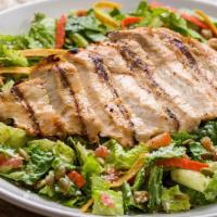 Grilled Chicken Mexican Caesar · Romaine lettuce, cotija cheese, tomatoes, roasted pepitas and crisp tortilla strips tossed i...