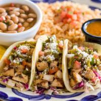 Street Taco Trio - Chicken · Three chicken street tacos served with frijoles de la olla and rice.