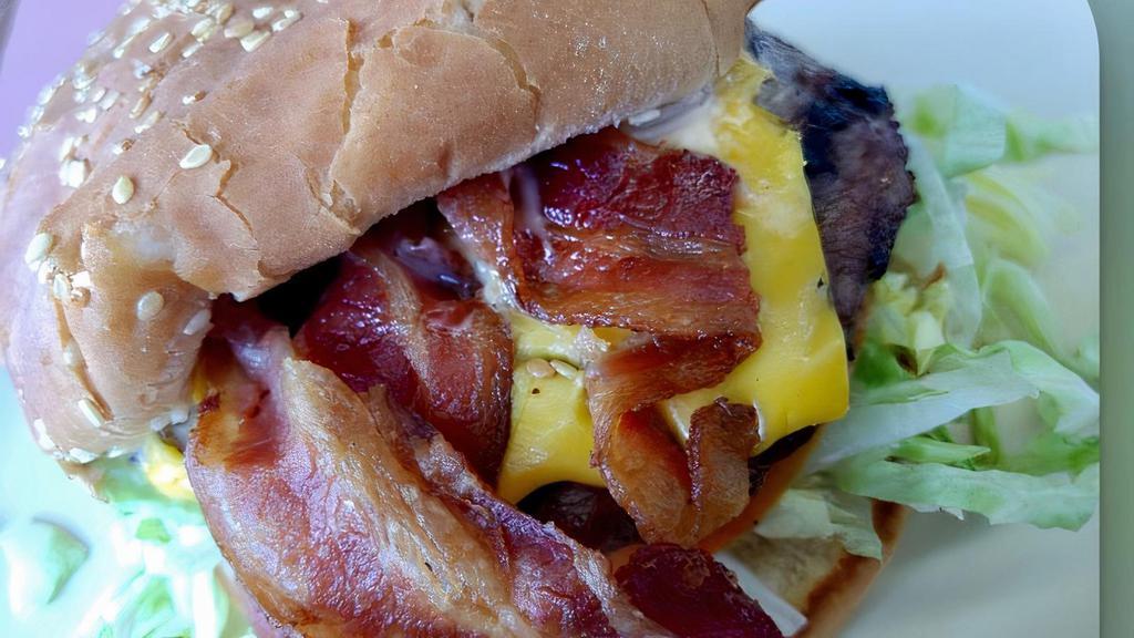 Bacon Cheeseburger · Our tasty 1/4 Burger topped with Bacon, Cheese, lettuce, tomatoes, onion, pickles and our housemade 1000 island dressing