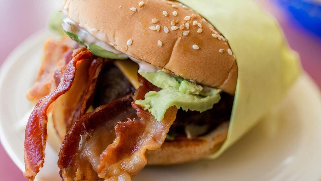 Avocado Bacon Cheeseburger  · Our most popular Burger, with Bacon, Cheese, lettuce, tomatoes, onions, pickles, 1000 island topped with fresh sliced Avocado.