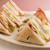 Club Sandwich · Ham, Turkey, Bacon, lettuce, tomato and mayo served on your bread of choice.