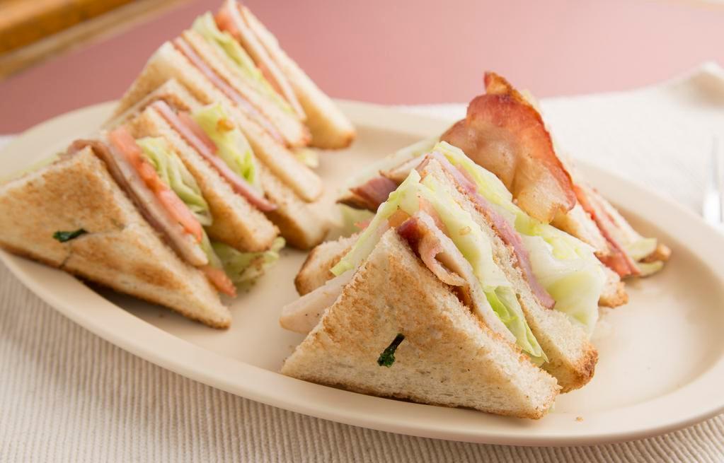 Club Sandwich · Ham, Turkey, Bacon, lettuce, tomato and mayo served on your bread of choice.