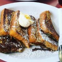 French Toast (A La Cart) · 3 Whole pieces(6 halves) of French Toast cut topped with Powdered sugar and served with butt...