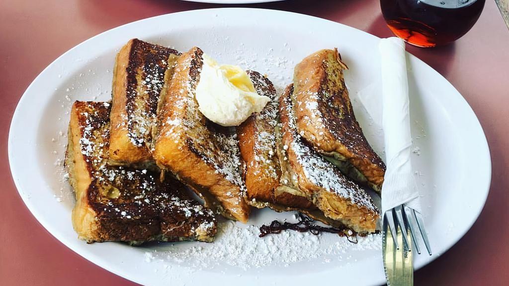 French Toast (A La Cart) · 3 Whole pieces(6 halves) of French Toast cut topped with Powdered sugar and served with butter and syrup on the side