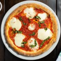 The Fan'S Margherita Dream · Take a bite of our authentic Neapolitan-style pizza topped with homemade San Marzano tomato ...