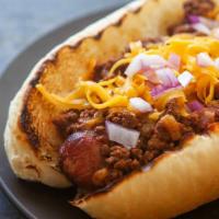 Chili Dog · Angus Dog on white bun; topped with Chili, Onions and Shredded Cheese.