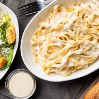 Fettuccine Alfredo Lunch Combo · Fettuccine covered in our classic Alfredo sauce with shredded parmesan. Served with a breads...
