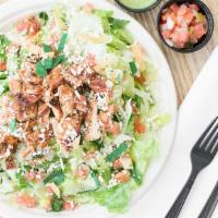 Caesar Salad · Romaine lettuce tossed with homemade Caesar dressing, topped with fresh Mexican cheese & tor...