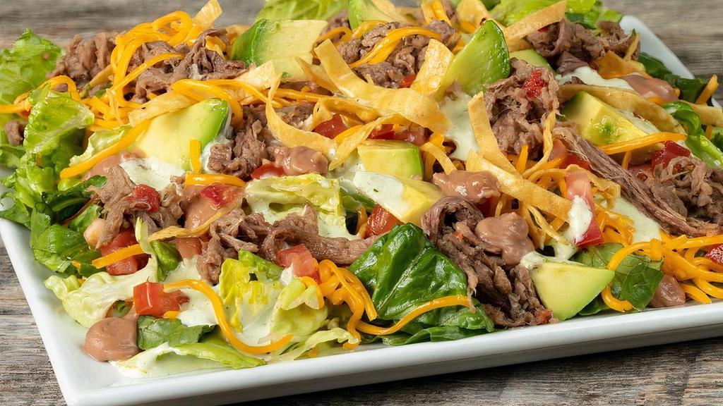 Taco Salad, Shredded Chicken · Fresh avocado, mixed greens, refried beans, cheddar cheese, tomatoes, crisp tortilla strips, house dressing and choice of meat