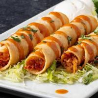 Fiery Taquitos, Chicken · Habanero hot sauce, cilantro, lettuce and sour cream served atop three shredded chicken taqu...