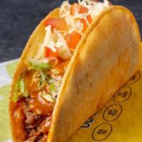 Fiery Crispy Taco, Shredded Beef · Shredded beef, habanero hot sauce, lettuce, Monterey jack cheese, and tomatoes served in a c...