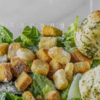 Caesar Salad · Romaine lettuce, Parmesan cheese, croutons and caesar dressing.