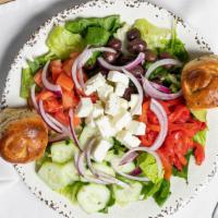 Greek Salad · Mixed greens, tomatoes, red onions, roasted bell peppers, cucumbers, calamata olives and Fet...