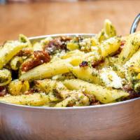 Chicken Pesto Penne · Olive oil pesto sauce, chicken, feta cheese and roasted tomatoes