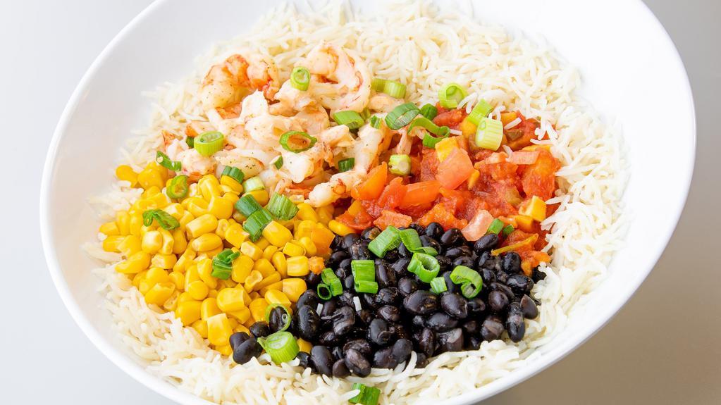 Caribbean Shrimp Rice Bowl · Wild-caught Argentinian red shrimp, black beans, yellow corn, white basmati rice, topped with mango-peach salsa, green onion, chile-lime drizzle, & fresh lime.