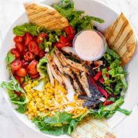 Fire-Roasted Southwest Chicken · Romaine, grape tomato, organic corn, roasted red pepper, fresh jalapeño, tri-colored tortill...
