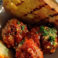 Polpette Di Nonna · Classic Style Meatballs Simmered in Marinara and Served with Garlic Crostini