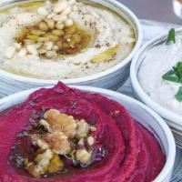 Hummus Trio · Classic Hummus / Beet Hummus / White Bean Hummus / Served with Artisan Bread