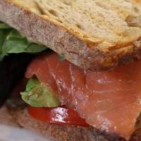 Smoked Salmon Panini · Cold-smoked gravlox style salmon/ avocado/ tomato/ miso mayonnaise/ lime

Served on Bread & ...