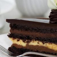 La Bete Noir (Slice) · A marriage of chocolate and vanilla. This layer cake is made with semi-sweet chocolate mouss...