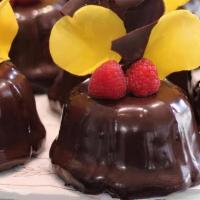 Bundt Cake Chocolate Caramel Truffle · Sour cream chocolate cake with a caramel ganache center and a double dipped chocolate glaze....