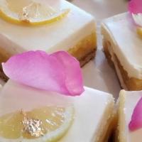 Lemon Bar Cheesecake · A creamy layer of cheesecake on top of our popular Lemon Bar.

ALLERGEN INFORMATION:
Contain...
