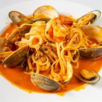 Linguine Pescatore · Past with fresh manilla clams, shrimp, calamari and mussels in white wine garlic tomato sauce.