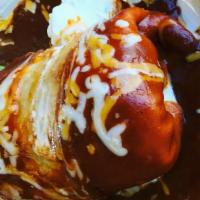 The Super Jolly Wet Burrito · For super appetites! 4 oz more meat than our regular burritos, beans and rice. Topped with r...