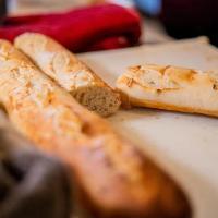 Baked Baguette · A fully baked sourdough baguette! Enjoy the warm soft freshness right out the oven!