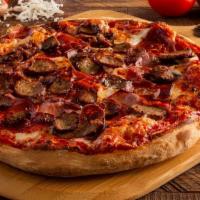 Meat Lovers · Pizza sauce, mozzarella cheese, pepperoni, Italian sausage, meatballs, ham, and salami.