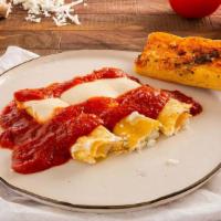 Manicotti · Crepe like pasta stuffed with ricotta cheese topped with Marinara sauce and mozzarella cheese.