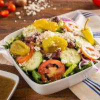 Greek Salad · Romaine lettuce, Greek olives, cucumbers, tomatoes, red onions, and feta cheese.