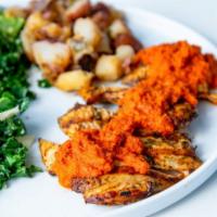 Peri Peri Chicken Plate · country potatoes, kale salad with toasted almonds, peri peri sauce