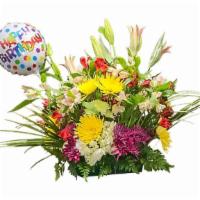 Joyful Colors · Red roses, hydrangeas, lilies, alstroemeria, mums, daisies, leather leaf, and palm leaves.

...