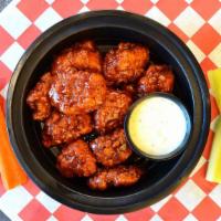 Boneless Wings  · Tossed in your choice of Nashville Hot Honey sauce served with celery, carrots and a side of...