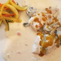 Pollo Con Rajas Con Crema · Grilled marinated chicken breast topped with roasted pasilla chilies in a cream sauce, accom...