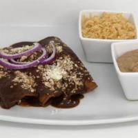 Enchiladas · A chicken or fresh cheese enchilada in a house mole or green tomatillo sauce, served with Sp...