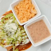 Taquitos · Three taquitos of your choice of beef, potatoes, chicken or beans, served with Spanish rice ...