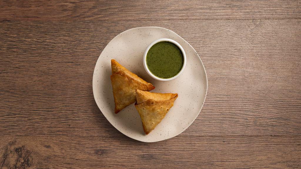 Chicken Samosa Plate · Two crispy pastries fried, stuffed with meat and vegetable.