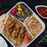Chicken Kebab Plate · Grilled marinated chicken, hummus, basmati rice, grilled tomato and jalapeño, shepherd salad...