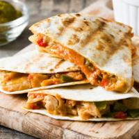 Chicken Quesadilla · Hot Quesadilla made with Chicken, peppers, onions, mixed mozzarella and cheddar cheese. Incl...