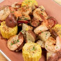 Southern Cajun Shrimp Boil · Tender, succulent boiled shrimp and fresh red potatoes tossed with grilled sausage and corn,...