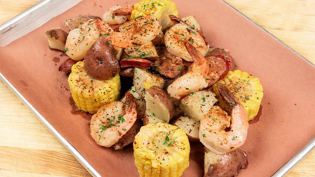 Southern Cajun Shrimp Boil · Tender, succulent boiled shrimp and fresh red potatoes tossed with grilled sausage and corn, in house-made cajun butter and our very own cajun seasoning blend.     . Make it family style (serves 4)