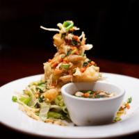 Railroad Camp Shrimp · Hand-battered, tempura style shrimp tossed with wontons and peanuts in our sweet and spicy g...