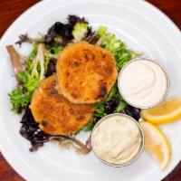 Jumbo Lump Crab Cakes · Pan-seared, loaded with jumbo lump crab meat and a bleand of seasonings. Served with housema...