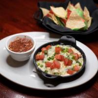 Spinach & Artichoke Dip · A rich and creamy four-cheese blend with fresh spinach and artichoke hearts. Served with woo...