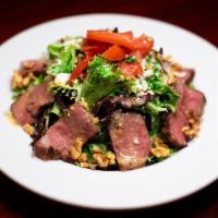 Joe'S Steak Salad · Thinly-sliced Joe's Steak® tops this hearty salad of baby field greens tossed with a light C...